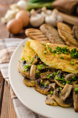Rustic omelette with mushrooms on chives