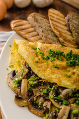 Rustic omelette with mushrooms on chives