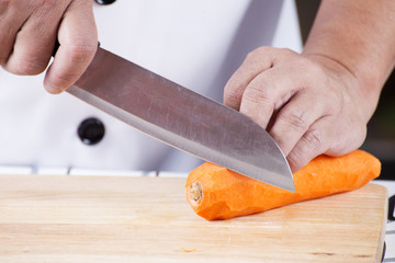 Chef is peeling carrots