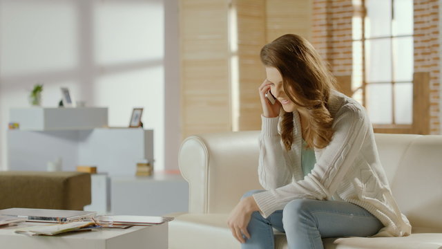 Young female calling, having phone conversation, ending call