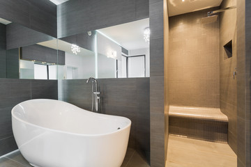 Naklejka na ściany i meble Bathroom with bathtub and shower