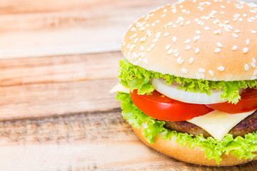 Hamburger on wood table ,sun flare filter effect