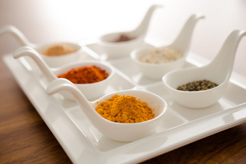 Wooden table of colorful spices