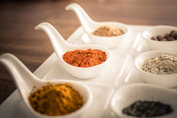 Wooden table of colorful spices