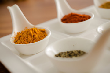 Wooden table of colorful spices