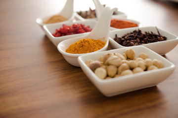 Wooden table of colorful spices