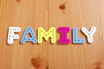 FAMILY, spell by woody puzzle letters with woody background