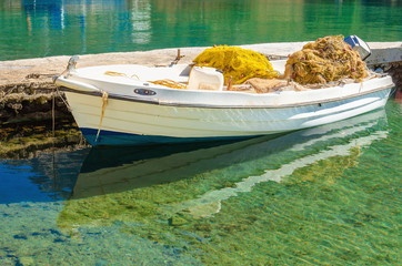 Obraz premium White boat with fisherman's net