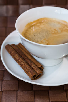 coffee cup  with cinnamon sticks