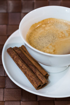 coffee cup  with cinnamon sticks