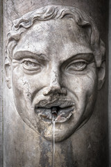 Fototapeta na wymiar Fountain with face