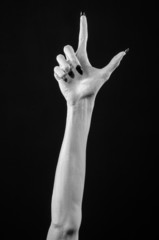 white hands of death with black nails, white death, white skin