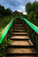 Obraz premium Old wooden ladder leading to the house