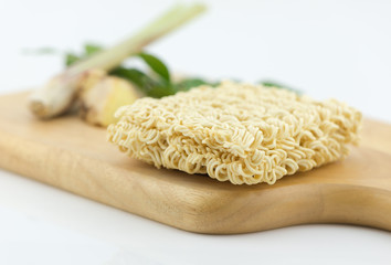 asian ramen instant noodles on cutting block