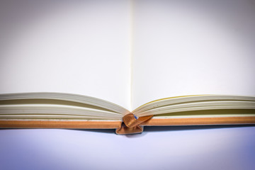 close up of open textbook with blank pages