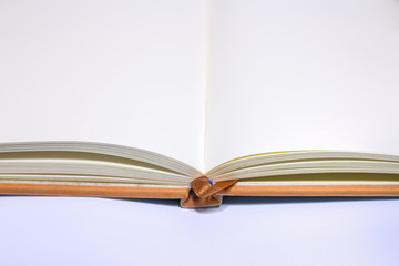 close up of open textbook with blank pages