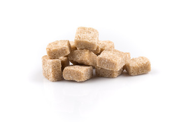 Heap brown sugar cubes isolated