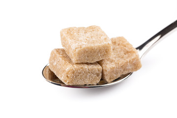 Cubes of sugar on a spoon