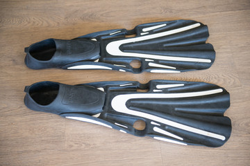flippers for diving on the wood floor