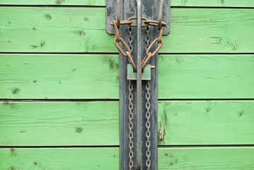 Green Wooden Gates with Lock and Chains