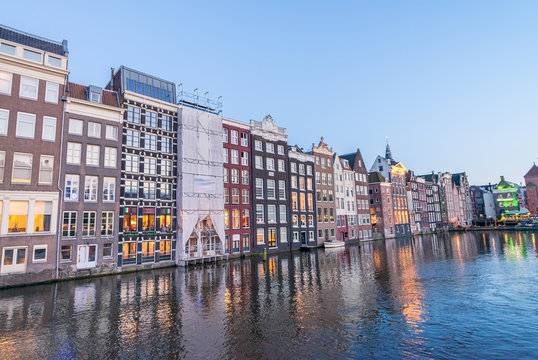 Amsterdam city homes at dusk along canal