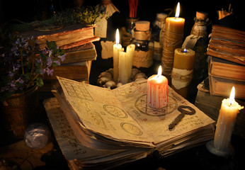 Halloween still life with candles and magic objects 