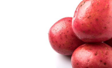 Red potato over white background