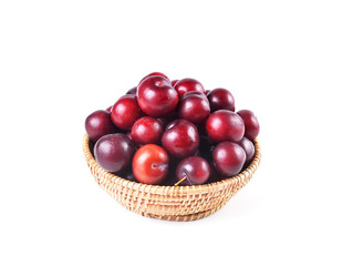 Basket full of fresh ripe cherry on a white background
