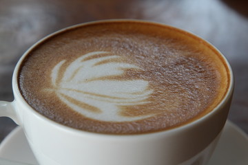 Hot cappuccino in white.