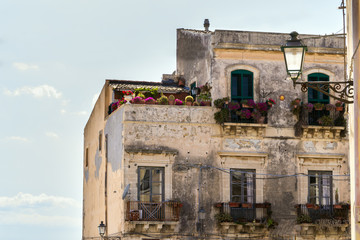 Old house facade with flowers, Syracuse
