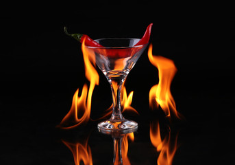 Flaming cocktail over black