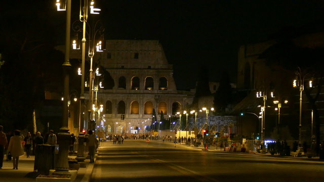 Colosseum / busy road to the Colosseum in Rome by night 