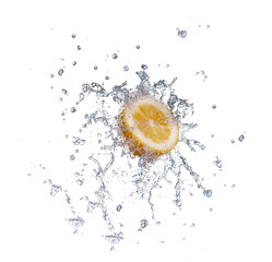 Fototapeta na wymiar segment of lemon falling in to the water and making splash