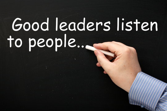 Good Leaders Listen to People reminder on a blackboard