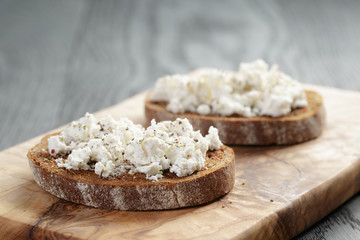 rye sandwich or bruschetta with ricotta cheese and herbs