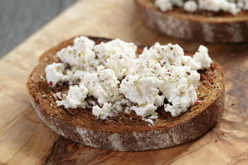 rye sandwich or bruschetta with ricotta cheese and herbs
