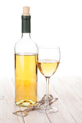White wine glass, bottle and corkscrew