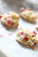 Freshly-baked biscuits on a parchment-lined pan