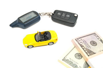 Fototapeta premium yellow car, keys and banknotes