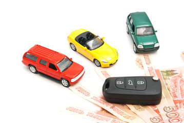 different cars, keys and Russian banknotes