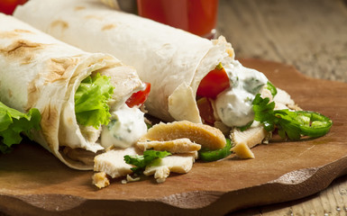 Turkish doner kebab, shawarma, roll with meat and pita bread on