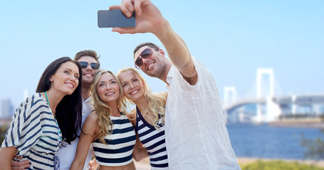 friends taking selfie with smartphone