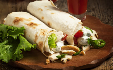 Turkish doner kebab, shawarma, roll with meat and pita bread on