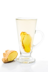 Hot ginger tea in glass in vertical format