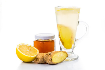 Hot honey lemon and ginger drinks in tall glass