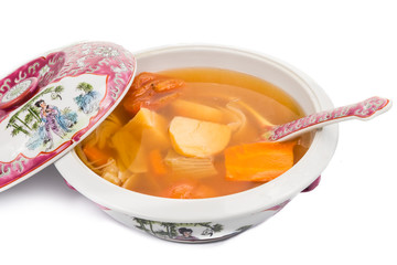 Casserole of Chinese potatoes, carrots and tomatoes soup
