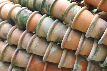Stacks of old clay flowerpots