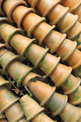 Stacks of old clay flowerpots