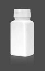 blank white supplement packaging bottle isolated on gray backgro