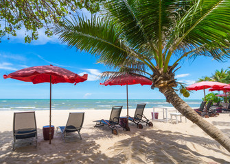 turquoise sea, deckchairs, white sand and palms, sun